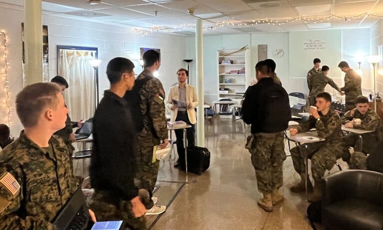 A representative from Christopher Newport University visits with cadets on the Fork Union campus.