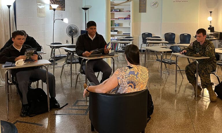 A representative of Longwood University shares information with cadets on a visit to the FUMA campus.