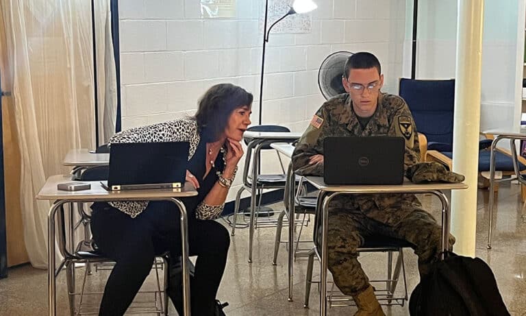 An ROTC representative from the University of Virginia meets with an interested cadet on the Fork Union campus.